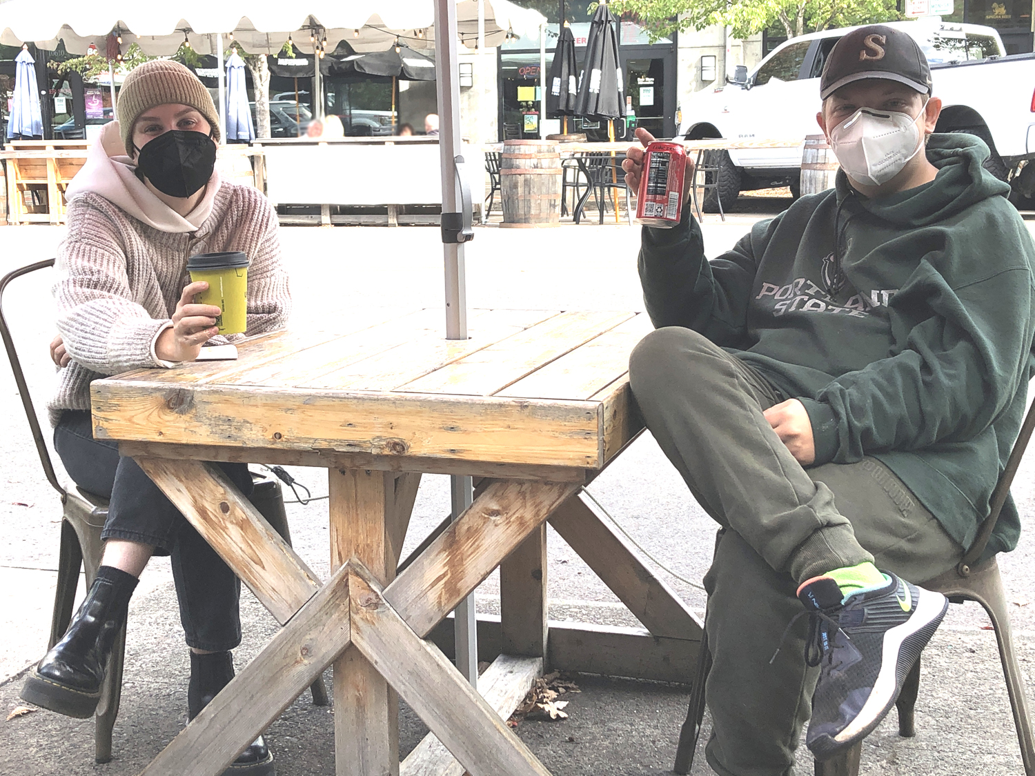 Two ACAP mentors enjoying drinks outside.
